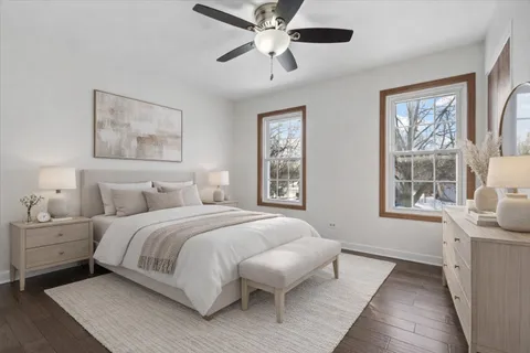 a bedroom with a large bed and a window