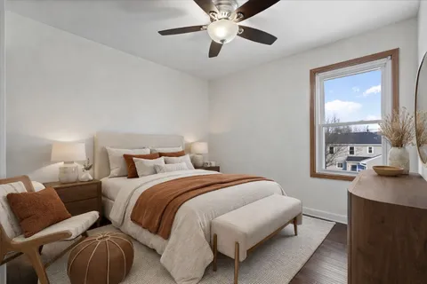 a bedroom with a bed and window