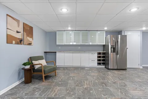 a view of a hallway with seating area