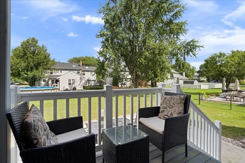 a view of a two chairs in the deck