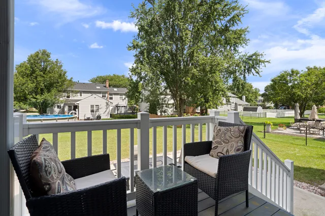 a view of a two chairs in the deck