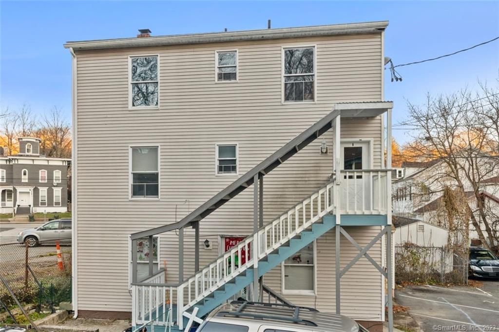 a view of a house with a wooden deck