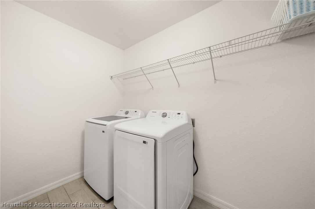 1204 Ridge Drive Avon Park, FL 33825 - Photo 16 of 20 a utility room with dryer and washer