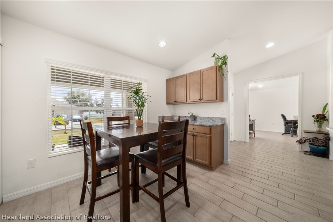1204 Ridge Drive Avon Park, FL 33825 - Photo 6 of 20 a view of a dining room with furniture and wooden floor