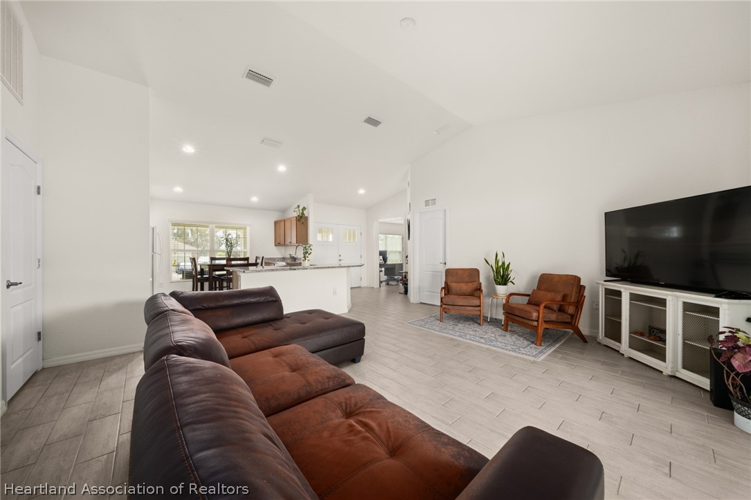 1204 Ridge Drive Avon Park, FL 33825 - Photo 7 of 20 a living room with furniture and a flat screen tv