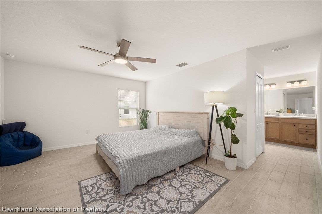 1204 Ridge Drive Avon Park, FL 33825 - Photo 8 of 20 a bedroom with a bed and a dresser