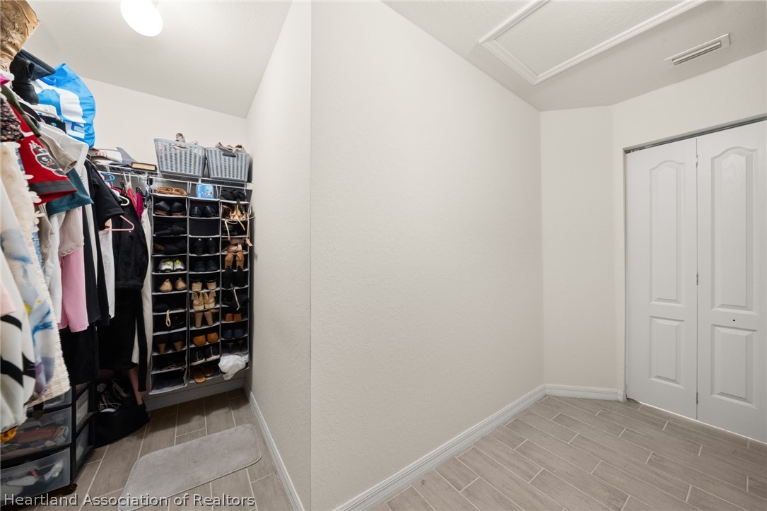 1204 Ridge Drive Avon Park, FL 33825 - Photo 10 of 20 a view of walk in closet with clothes and shoes