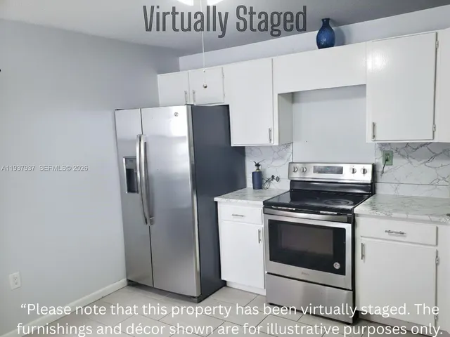 a kitchen with a stove microwave and refrigerator