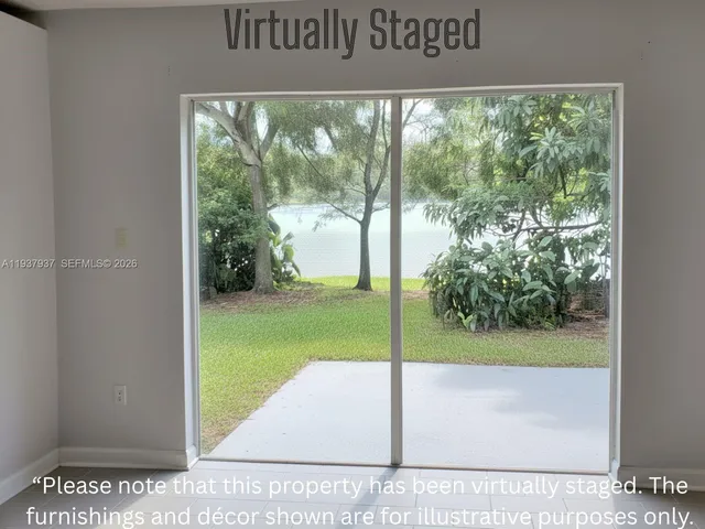 a view of a room with a big yard