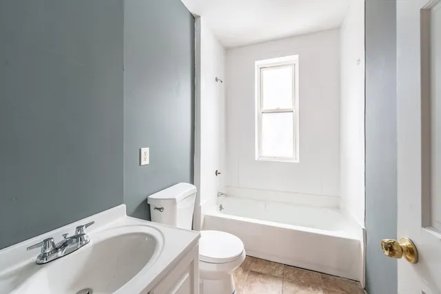 a bathroom with a sink toilet and bathtub