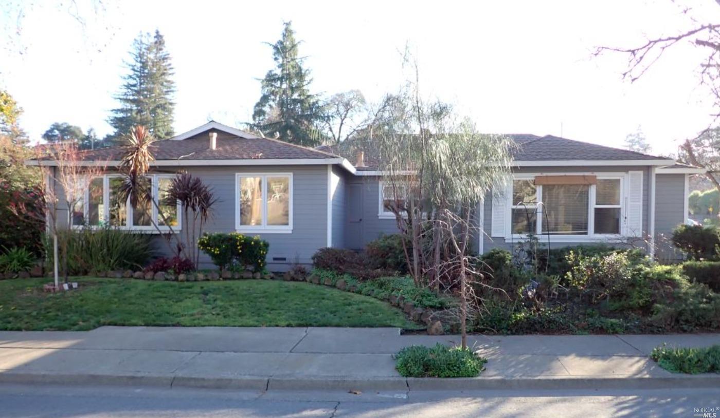 749 Mountain View Avenue Petaluma, CA 94952 - Photo 1 of 1 a front view of a house with a yard and potted plants