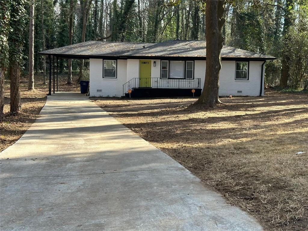 2212 Camp Ground Road Southwest Atlanta, GA 30331 - Photo 1 of 1 a front view of a house with a outdoor space