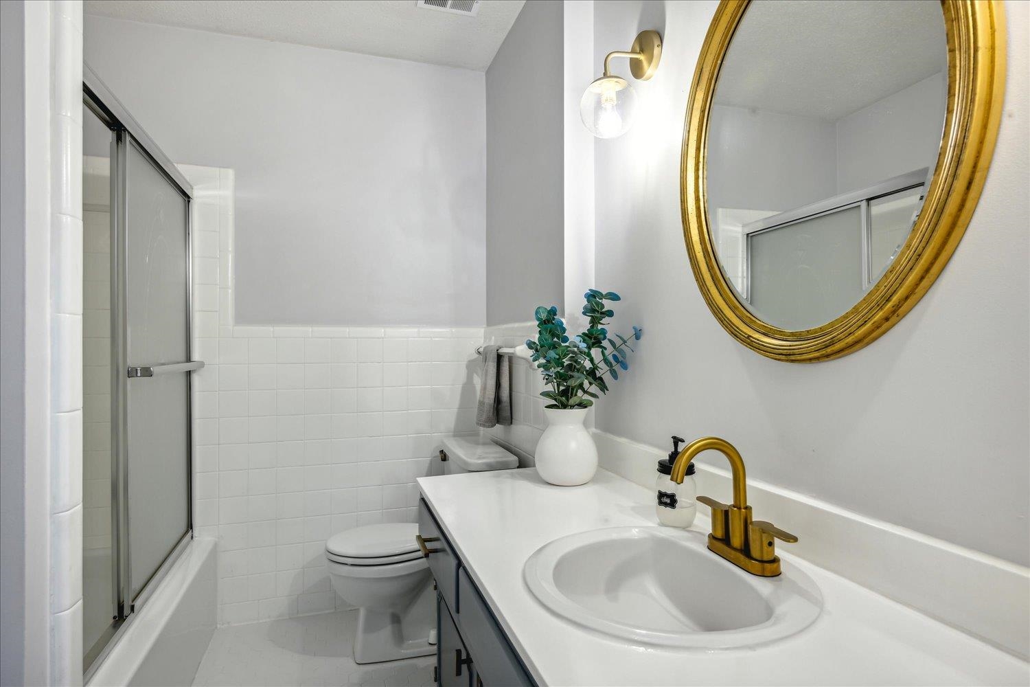 2397 Lynnfield Road Memphis, TN 38119 - Photo 13 of 28 a bathroom with a sink and a mirror