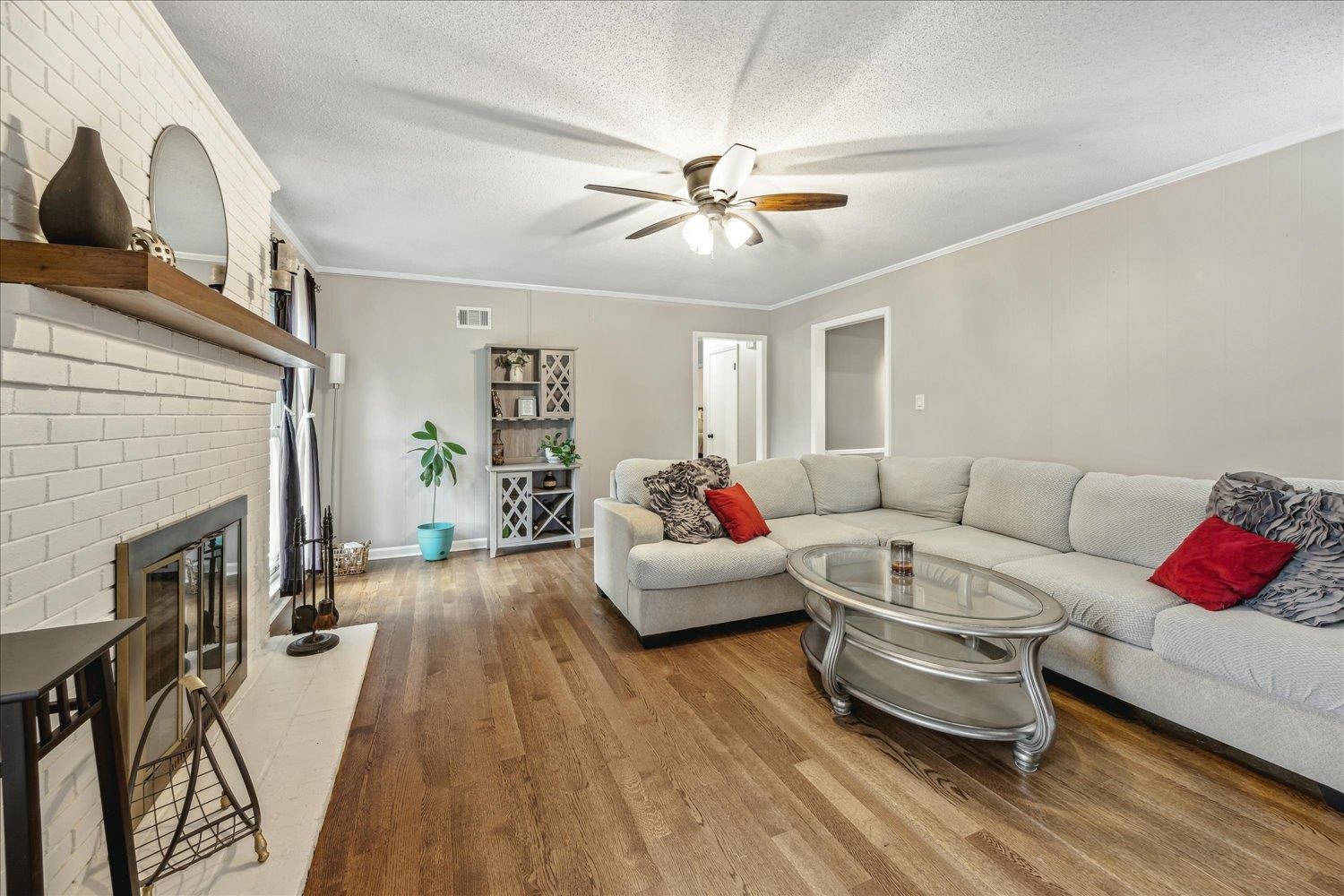 2397 Lynnfield Road Memphis, TN 38119 - Photo 15 of 28 a living room with furniture and a fireplace