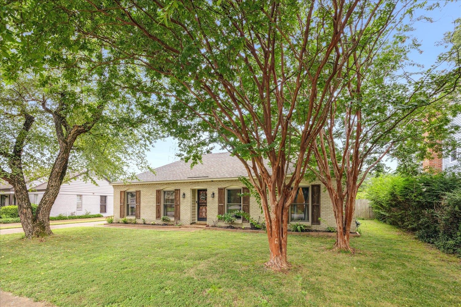 2397 Lynnfield Road Memphis, TN 38119 - Photo 2 of 28 a front view of a house with a garden