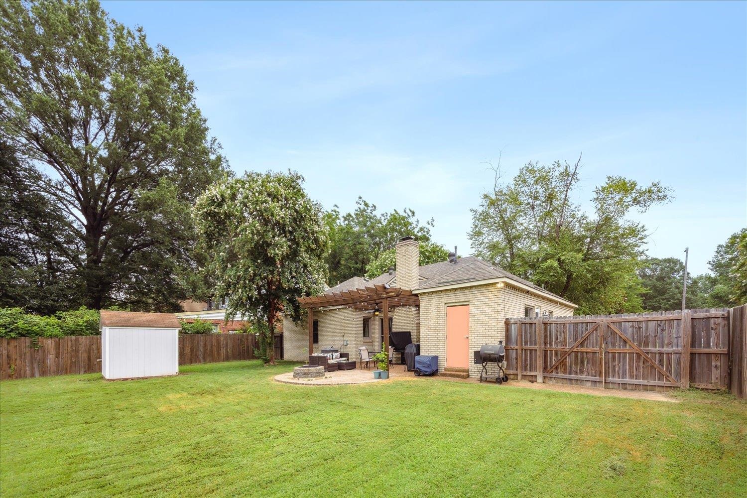 2397 Lynnfield Road Memphis, TN 38119 - Photo 27 of 28 a view of a house with a yard and sitting area