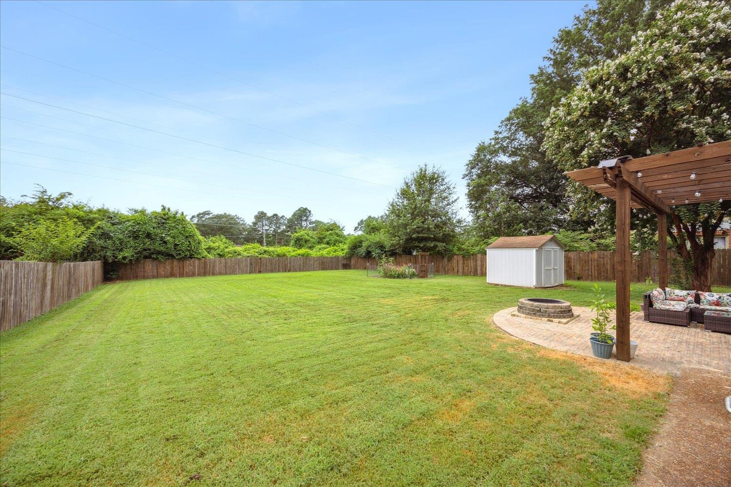 2397 Lynnfield Road Memphis, TN 38119 - Photo 28 of 28 a backyard of a house with table and chairs