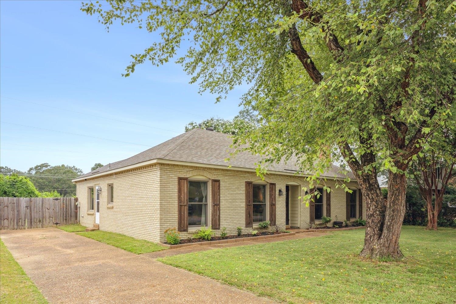 2397 Lynnfield Road Memphis, TN 38119 - Photo 3 of 28 a front view of a house with a garden