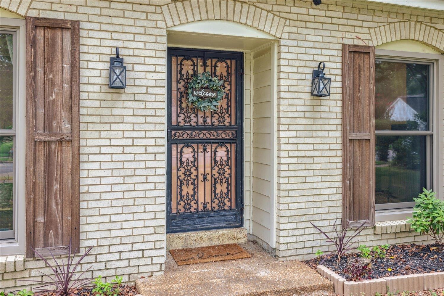 2397 Lynnfield Road Memphis, TN 38119 - Photo 4 of 28 a front view of a house with large windows