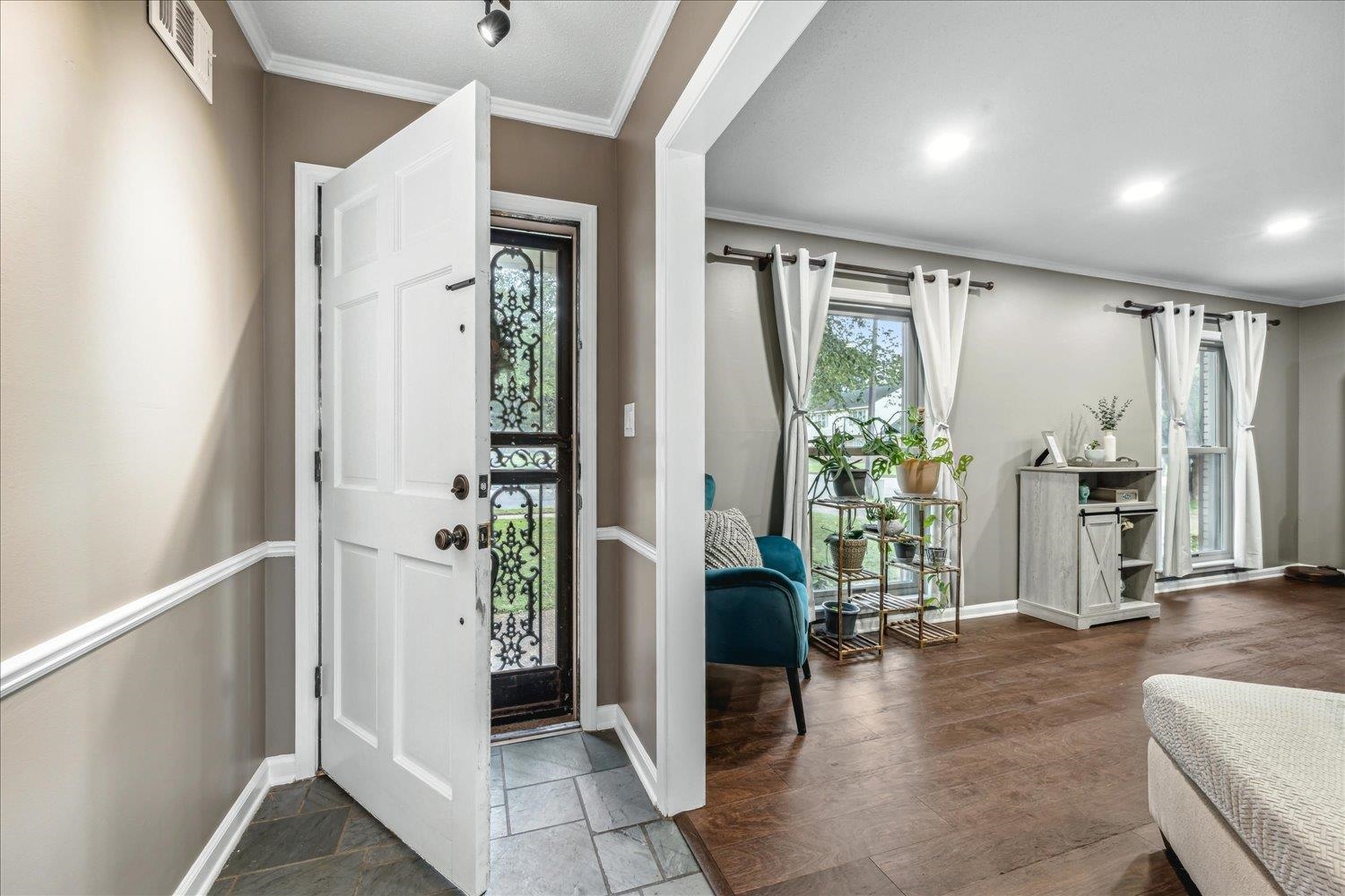 2397 Lynnfield Road Memphis, TN 38119 - Photo 5 of 28 a view of an entryway with wooden floor and a livingroom
