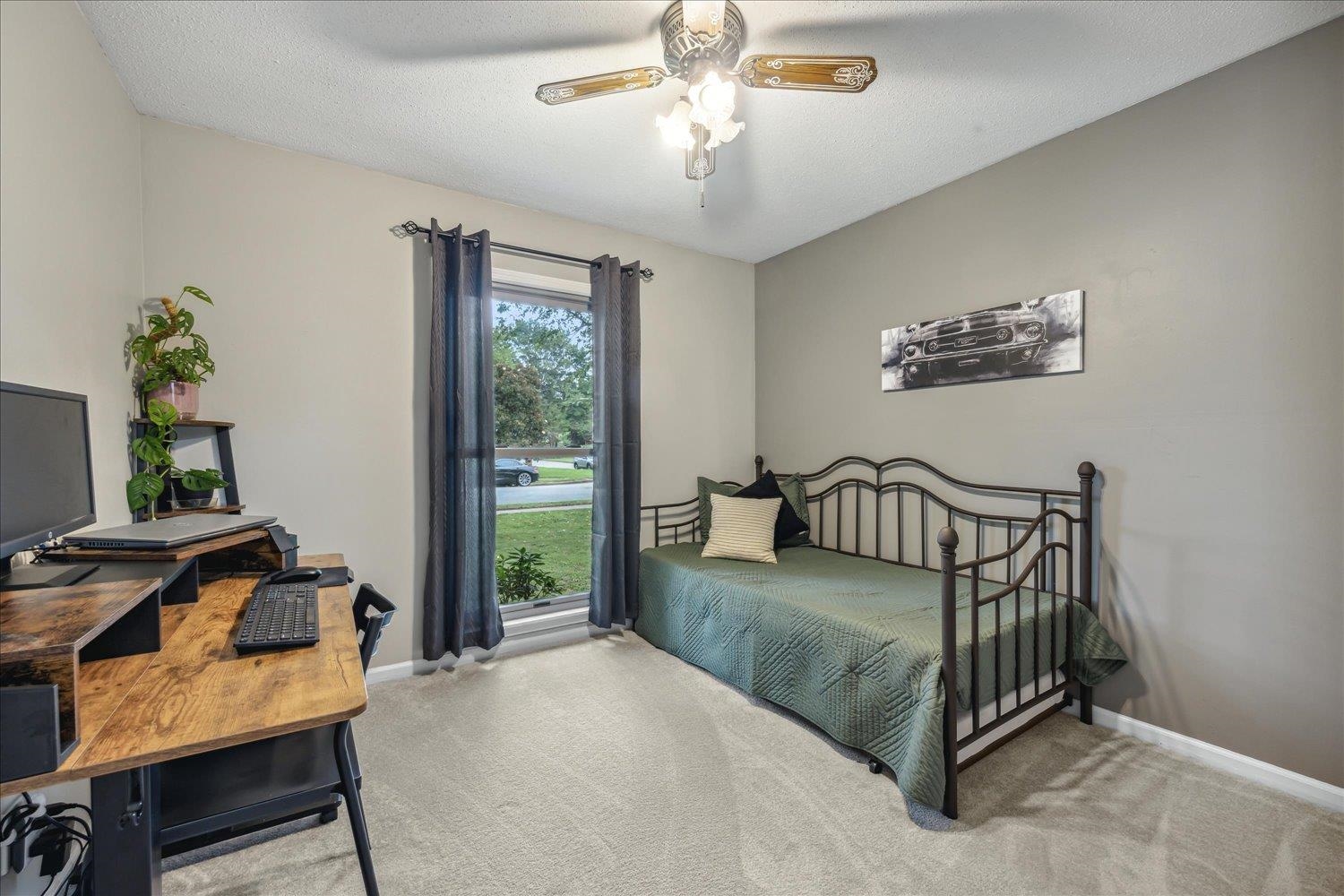 2397 Lynnfield Road Memphis, TN 38119 - Photo 7 of 28 a bedroom with furniture and a window