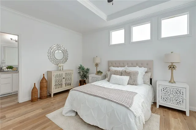 a bedroom with bed and a window