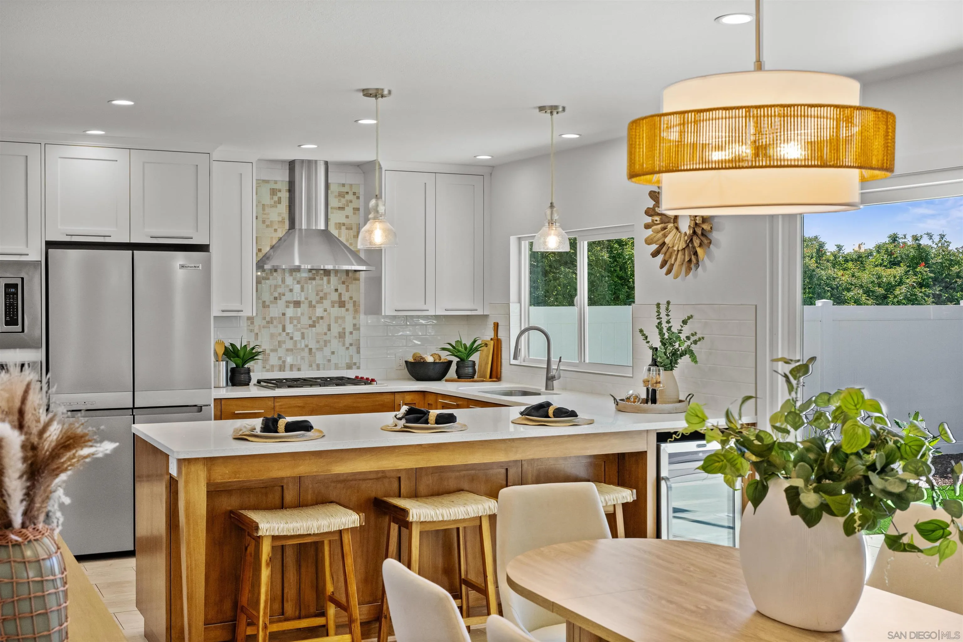 2001 Elevada Street Oceanside, CA 92054 - Photo 11 of 39 a kitchen with a sink a counter space and a dining table