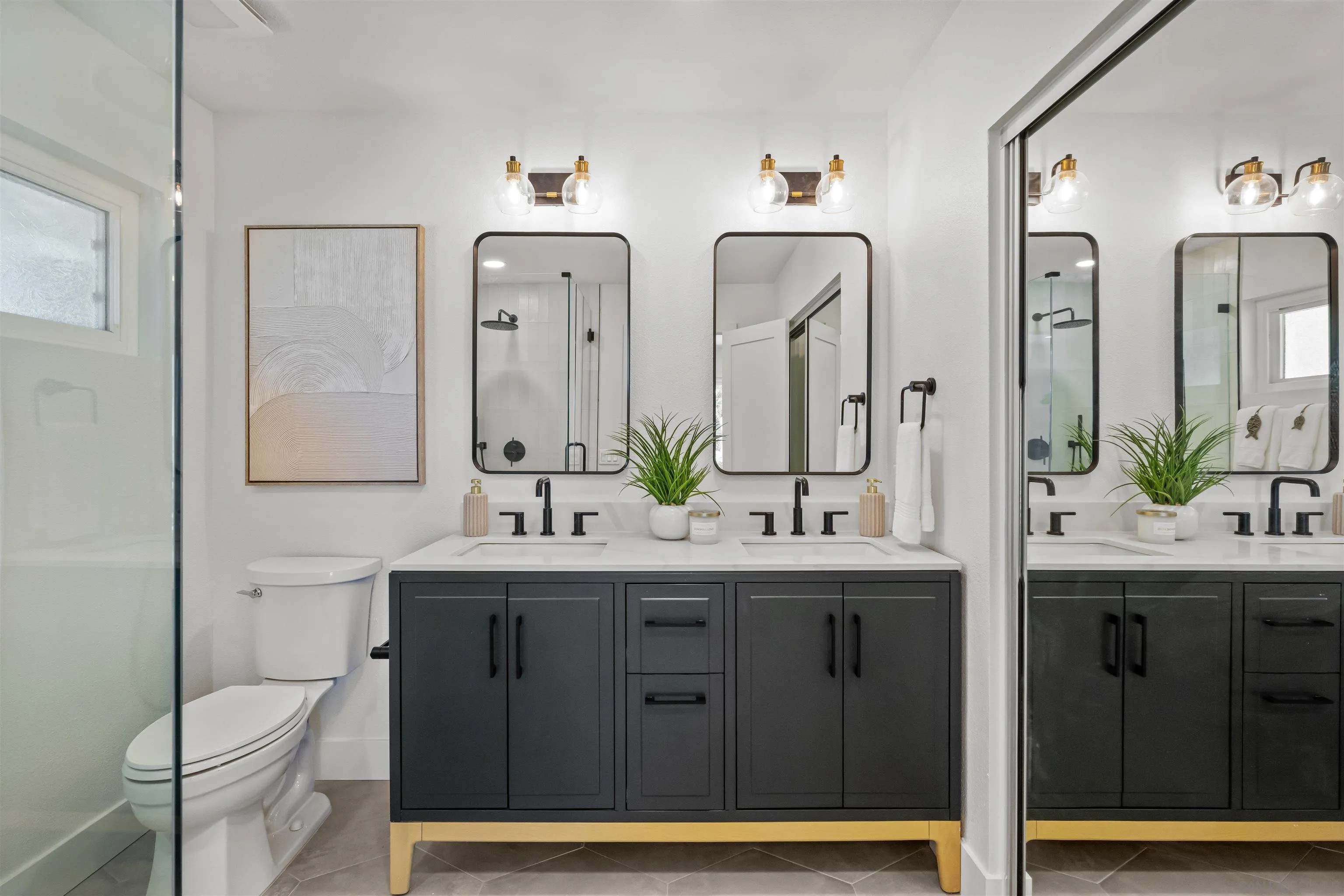 2001 Elevada Street Oceanside, CA 92054 - Photo 22 of 39 a bathroom with a double vanity sink and mirror