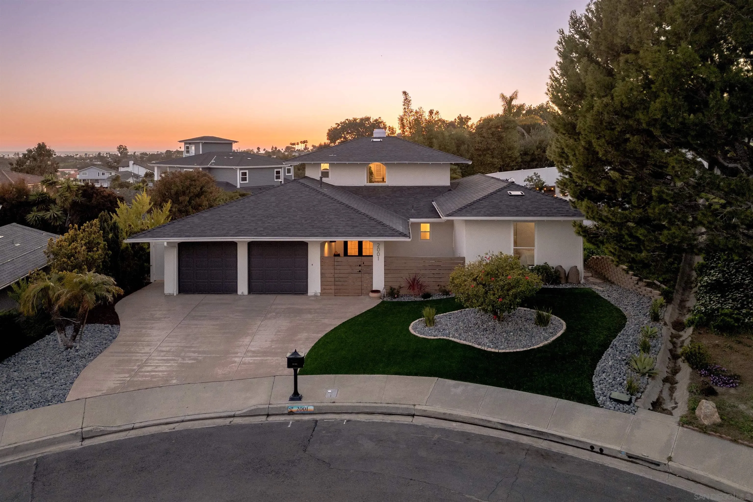 2001 Elevada Street Oceanside, CA 92054 - Photo 38 of 39 a front view of a house with a yard and garage