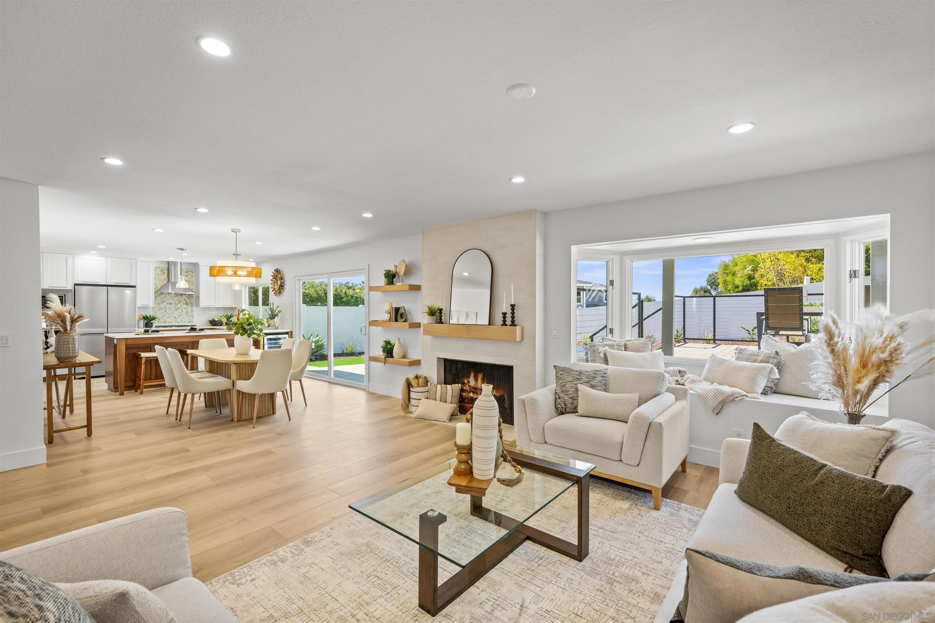 2001 Elevada Street Oceanside, CA 92054 - Photo 8 of 39 a living room with furniture a fireplace and a window