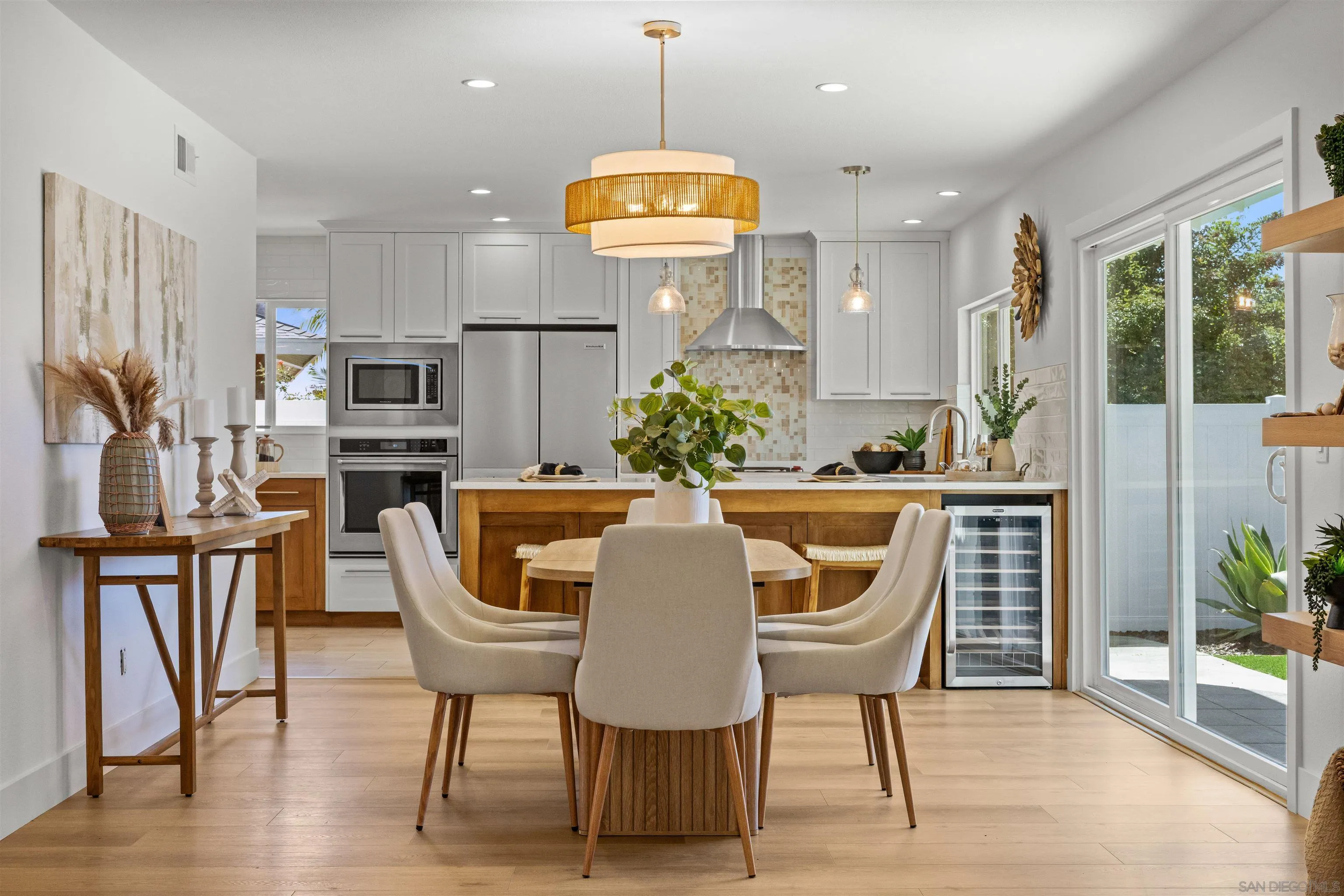 2001 Elevada Street Oceanside, CA 92054 - Photo 9 of 39 a view of a dining room with furniture window and wooden floor