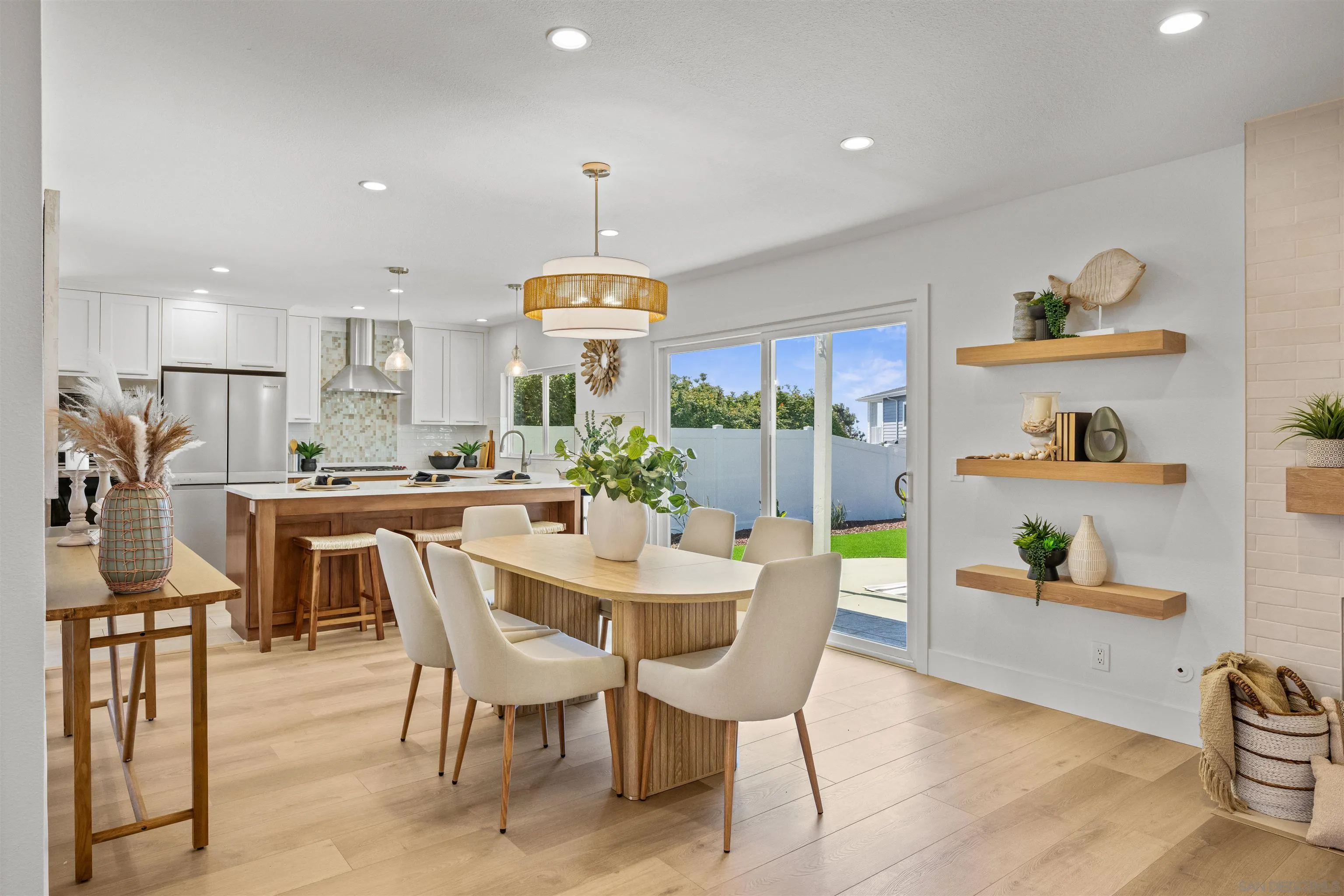 2001 Elevada Street Oceanside, CA 92054 - Photo 10 of 39 a view of a dining room with furniture and wooden floor
