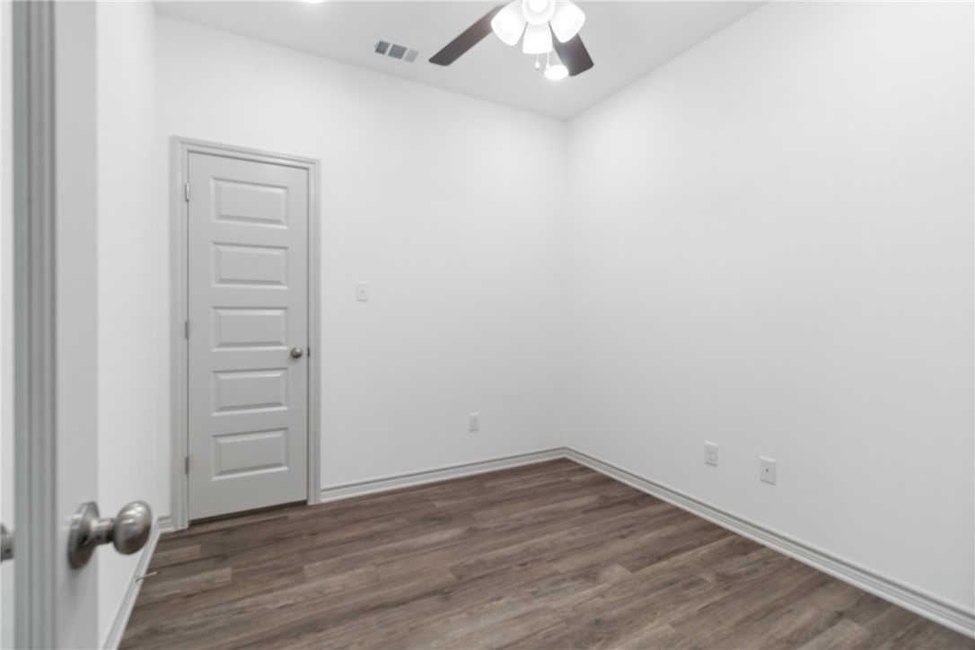 1900 Stubbs Drive Bryan, TX 77807 - Photo 11 of 15 wooden floor in an empty room