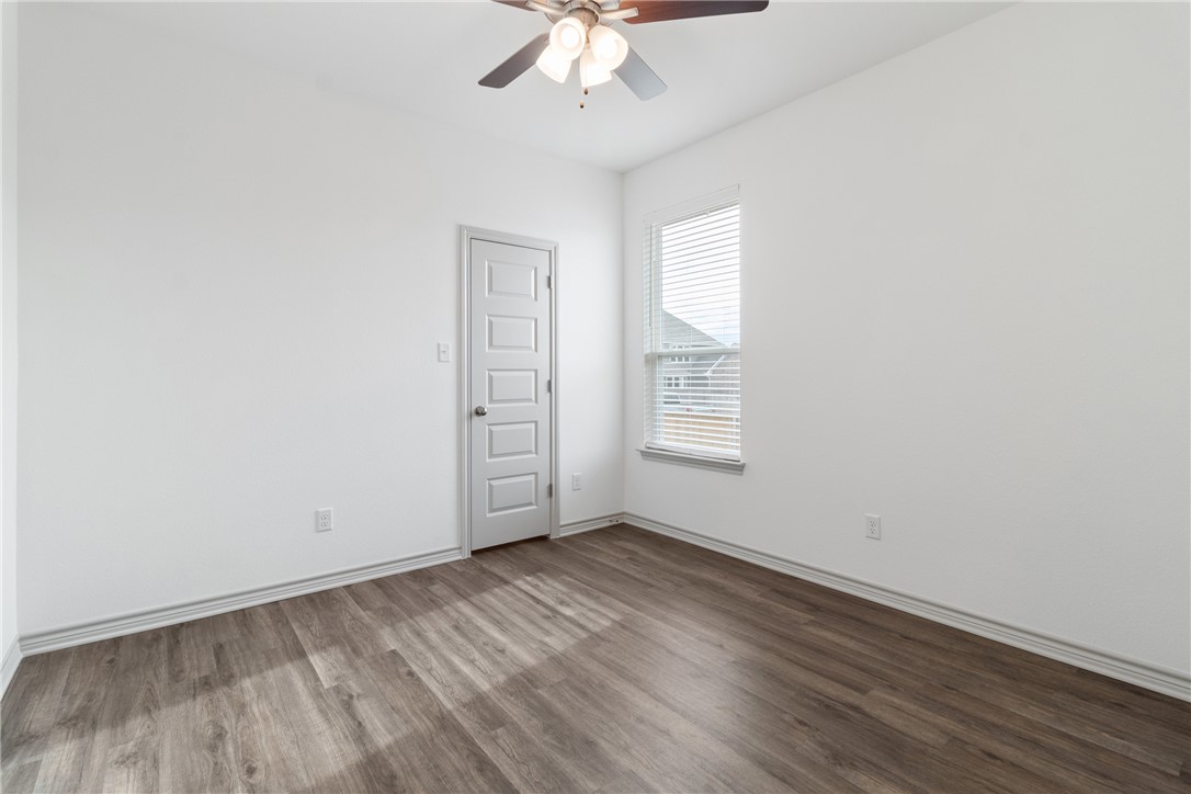 1900 Stubbs Drive Bryan, TX 77807 - Photo 12 of 15 an empty room with a window and a ceiling fan
