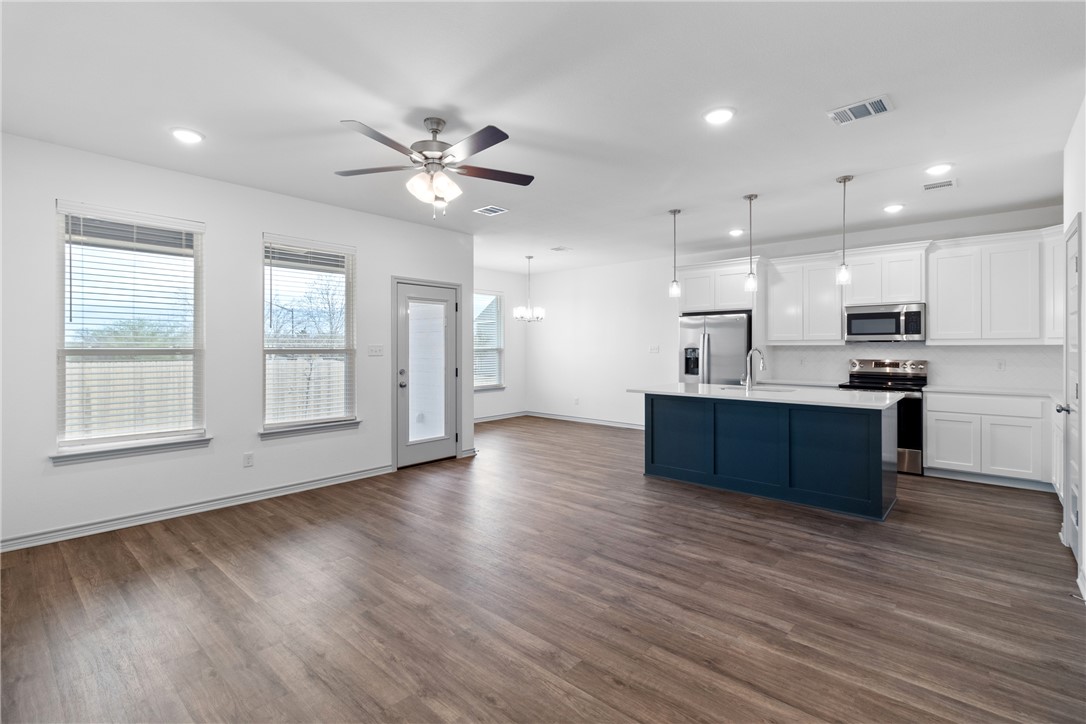1900 Stubbs Drive Bryan, TX 77807 - Photo 2 of 15 a view of kitchen with wooden floor and window
