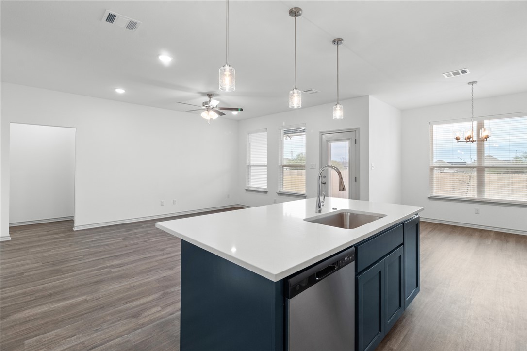 1900 Stubbs Drive Bryan, TX 77807 - Photo 3 of 15 a kitchen with a sink cabinets and wooden floor