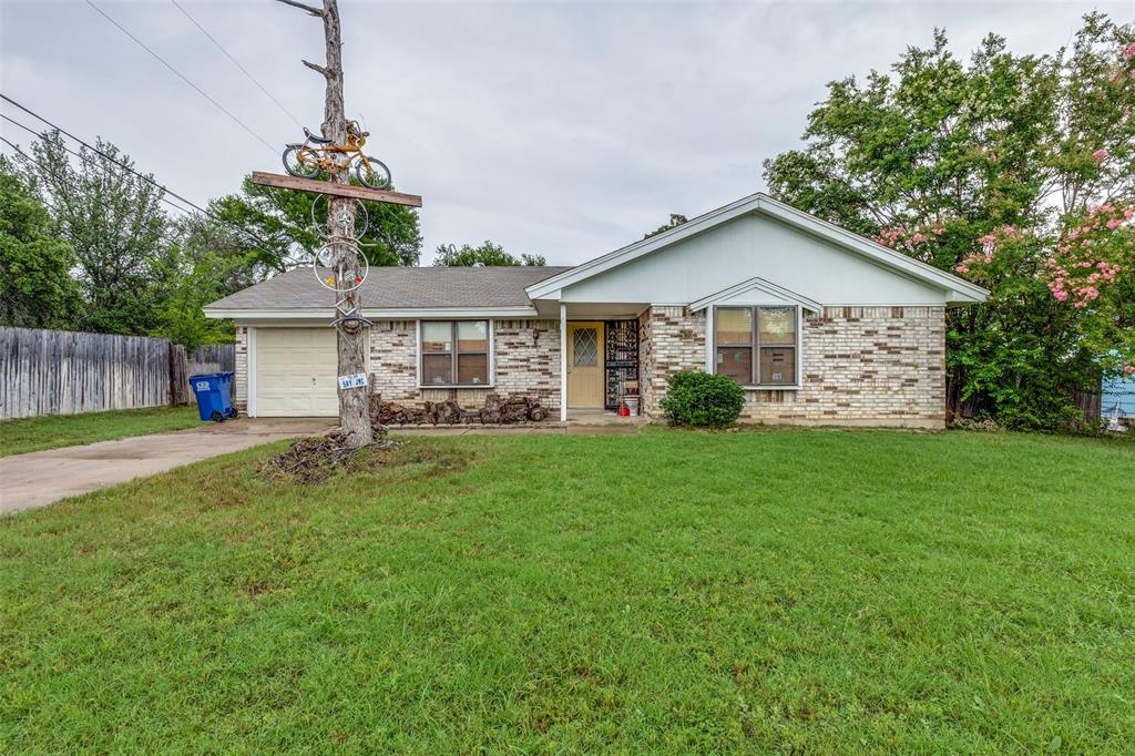 101 Gordon Drive Azle, TX 76020 - Photo 2 of 25 Single story home with driveway, a garage, and brick siding