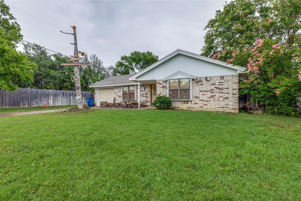 101 Gordon Drive Azle, TX 76020 - Photo 4 of 25 Ranch-style home featuring a garage and brick siding