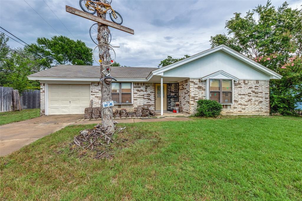 101 Gordon Drive Azle, TX 76020 - Photo 5 of 25 Ranch-style home featuring an attached garage, driveway, and brick siding