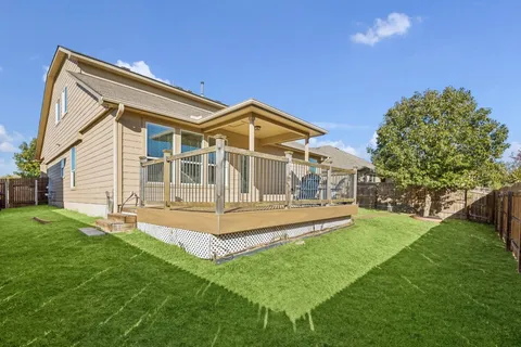 a front view of a house with a yard table and chairs