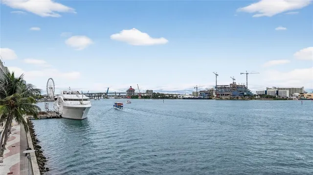 a view of a chairs and table in front of house
