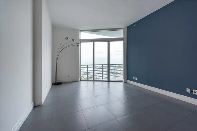 a view of an empty room with a window