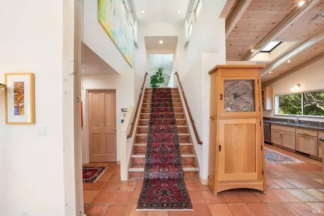 a vase of flowers sitting on a floor