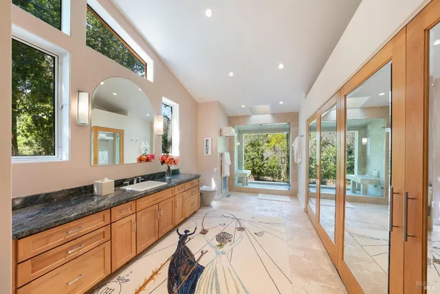 a view of a room with a large window and front door