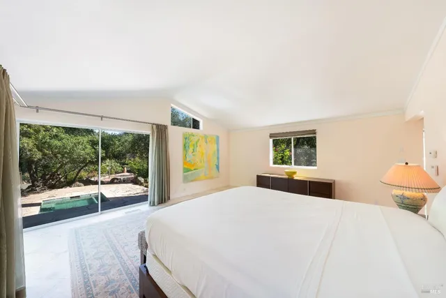 a view of a backyard with swimming pool