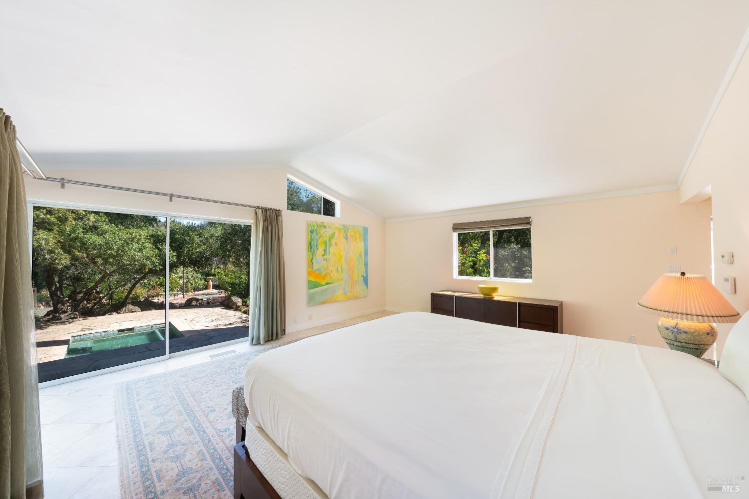 321 Dutch Henry Canyon Road Calistoga, CA 94515 - Photo 28 of 45 a bedroom with a bed and wooden floor