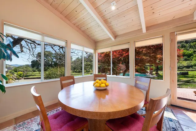 a large kitchen with stainless steel appliances granite countertop a sink and cabinets