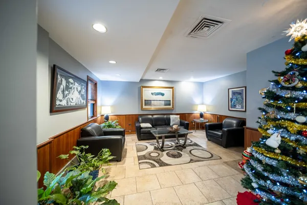 a view of a hallway with furniture