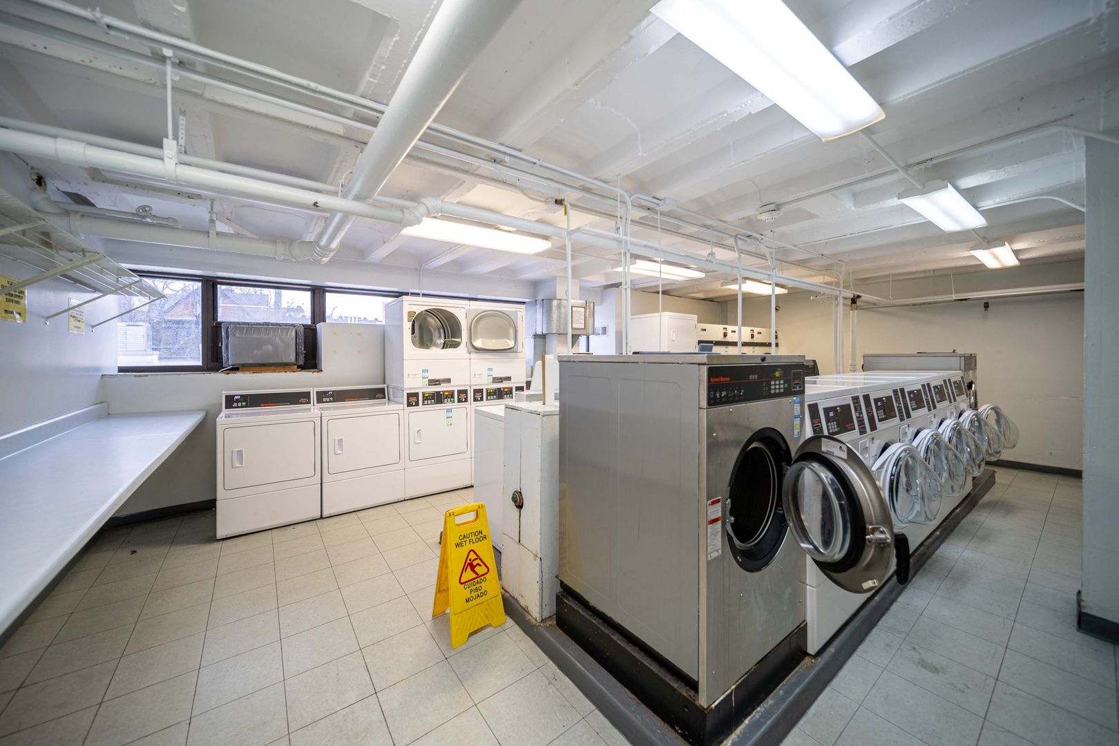 6030 North Sheridan Road, Unit 2011 Chicago, IL 60660 - Photo 21 of 26 a view of a storage & utility room with washer and dryer