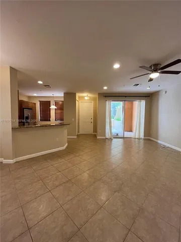 a view of a kitchen with a sink and cabinets